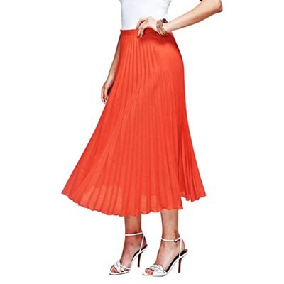 Orange pleat skirt in clever fabric